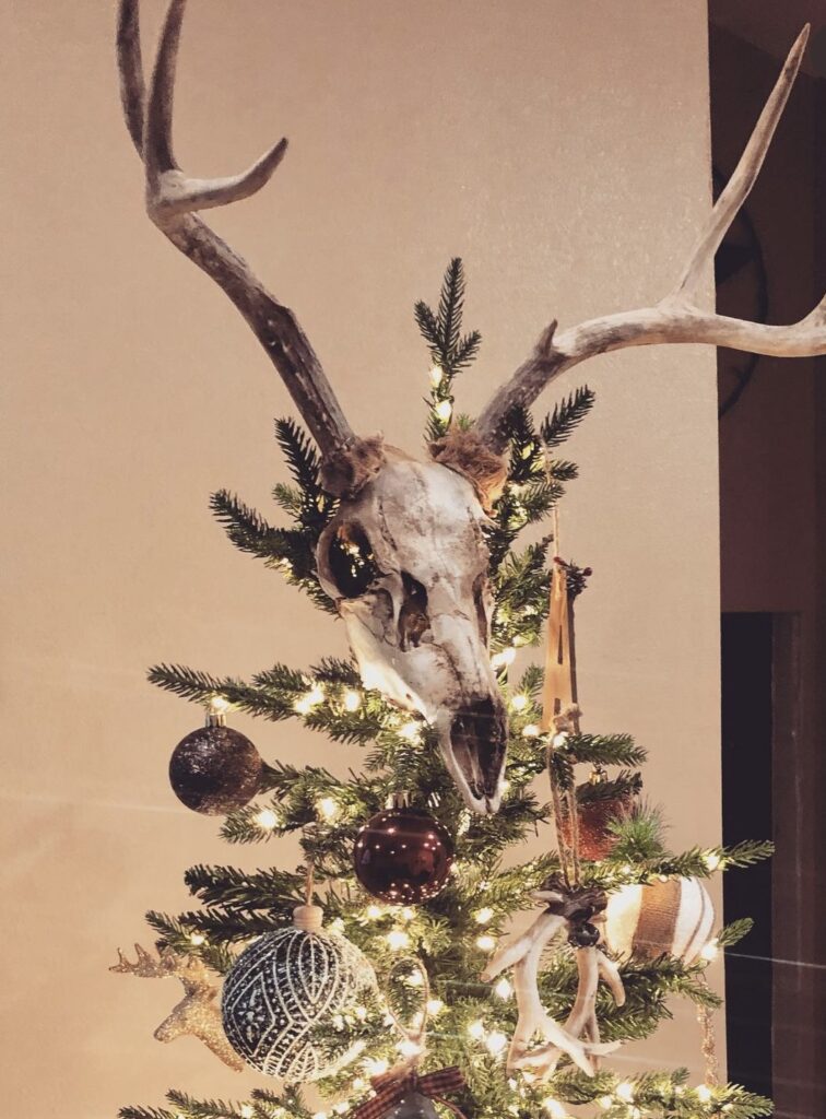 western christmas tree with antler tree topper