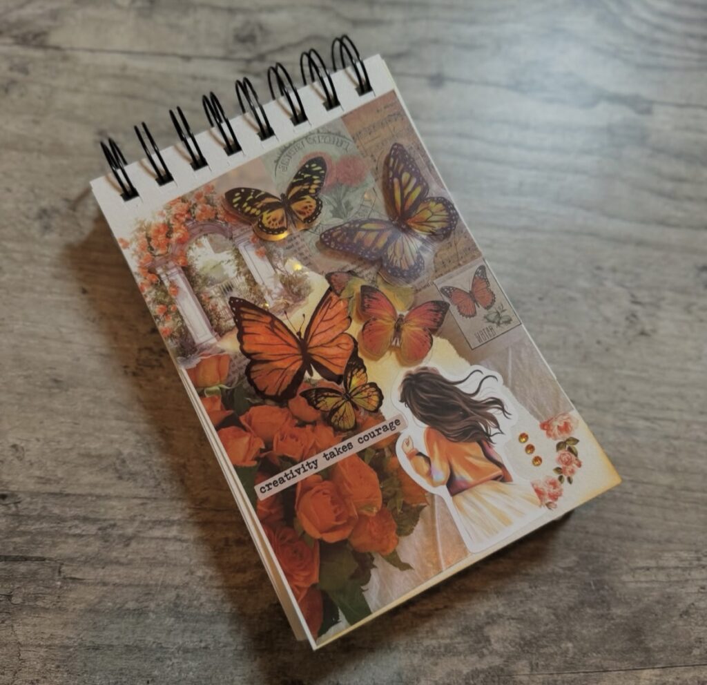 Example of Vibrant orange junk journal spread featuring ticket stubs, textured paper, and collage elements. Credit: scrapbookdiary__ on Instagram.