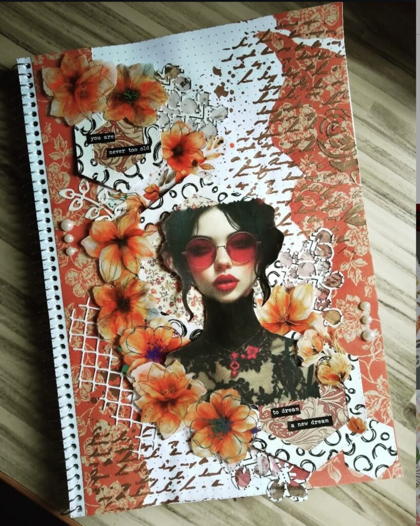 Orange scrapbook layout with creative collage, cutouts, and textured layers. Credit: i.live.in.a.bubble on Instagram.
