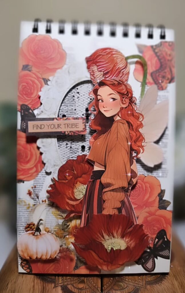 Non-seasonal orange scrapbooking idea with playful layers, paper flowers, and mixed textures. Credit: bibih_journaling on Instagram.