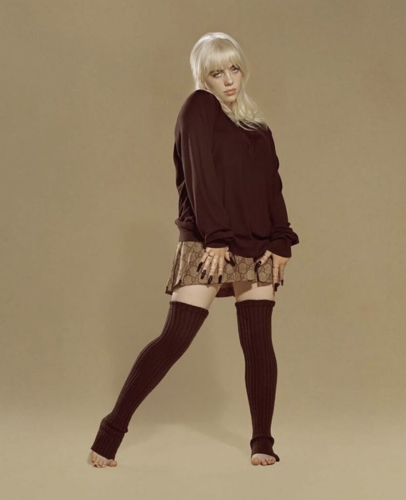 Billie Eilish with platinum blonde pinup hair and vintage-inspired makeup, showing a different side of her style for costume ideas. Photo credit: @billieeilish on Instagram via Slowestuff.com