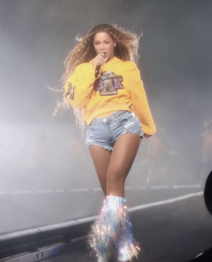 Beyoncé Coachella yellow hoodie and jean shorts—festival-inspired Halloween costume idea, iconic music performance outfit | Slowestuff.com