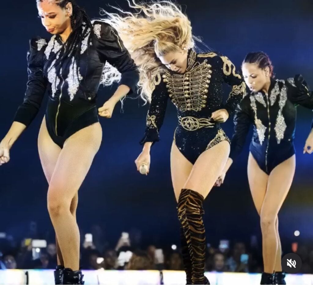 Beyoncé black and gold military jacket with thigh-high tiger boots—showstopping Halloween costume idea inspired by Beyoncé’s stage outfits | Slowestuff.com