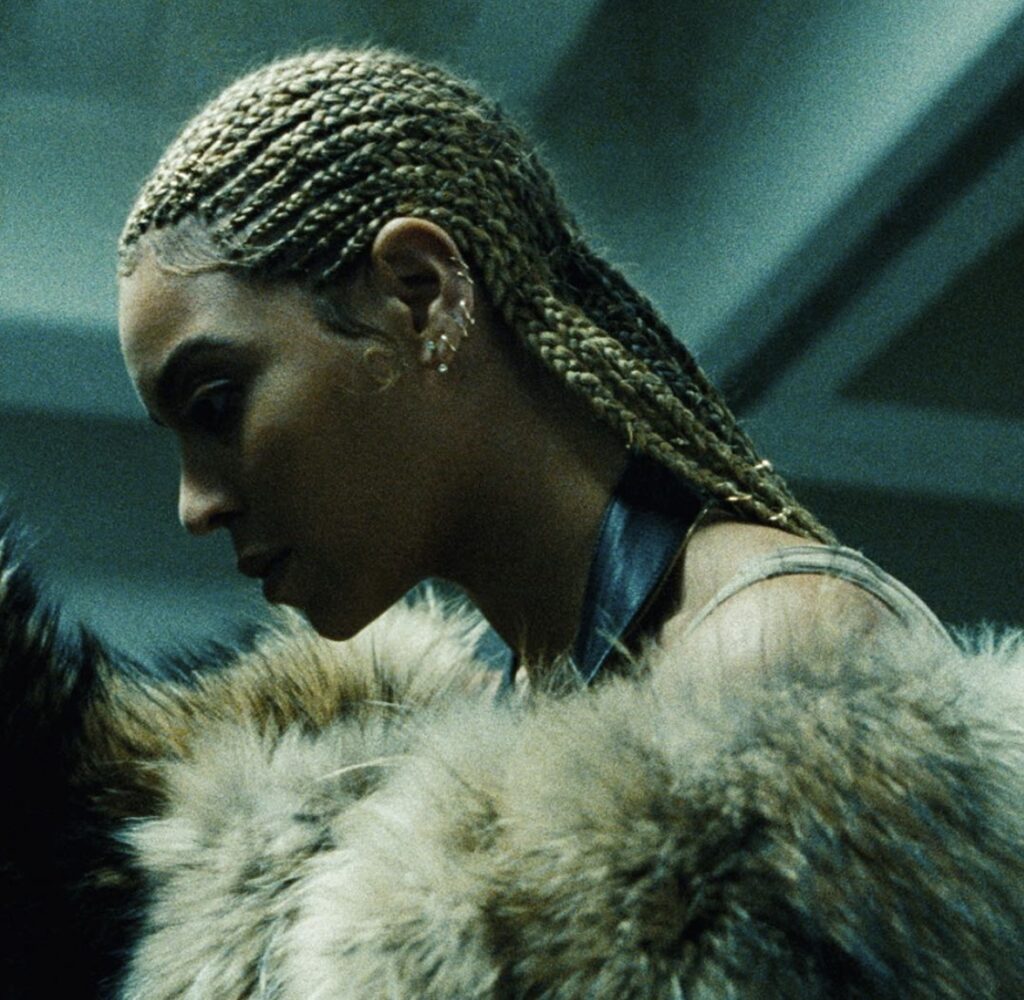 Beyoncé Lemonade era braids and faux fur coat—powerful Halloween costume idea inspired by the Lemonade album look | Slowestuff.com