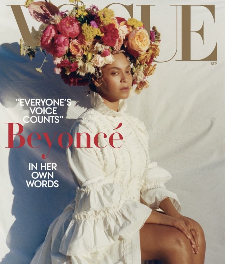Beyoncé Vogue magazine cover—white renaissance dress and oversized floral headpiece, elegant Halloween costume idea for Beyoncé fans | Slowestuff.com