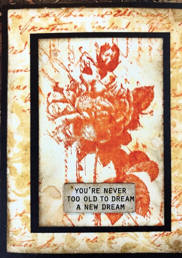 Orange color aesthetic mix media journal page example with bold brushstrokes and textured collage. Credit: mk_knits on Instagram.
