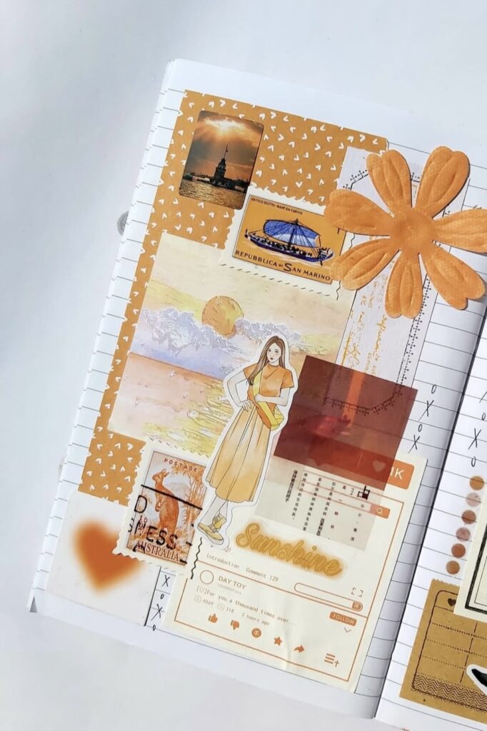 Orange journal page idea with textured layers, stamps, and scrapbooking embellishments. Credit: journalwithsofi on Instagram.