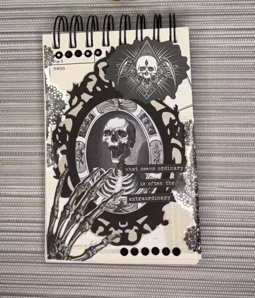 black and white junk journal layout with skeleton bust in frame
