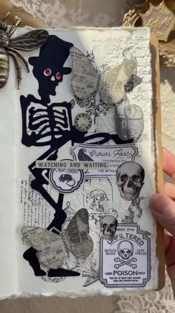 Black skeleton die-cut with red eyes and butterflies. Credit: bkpaperstories