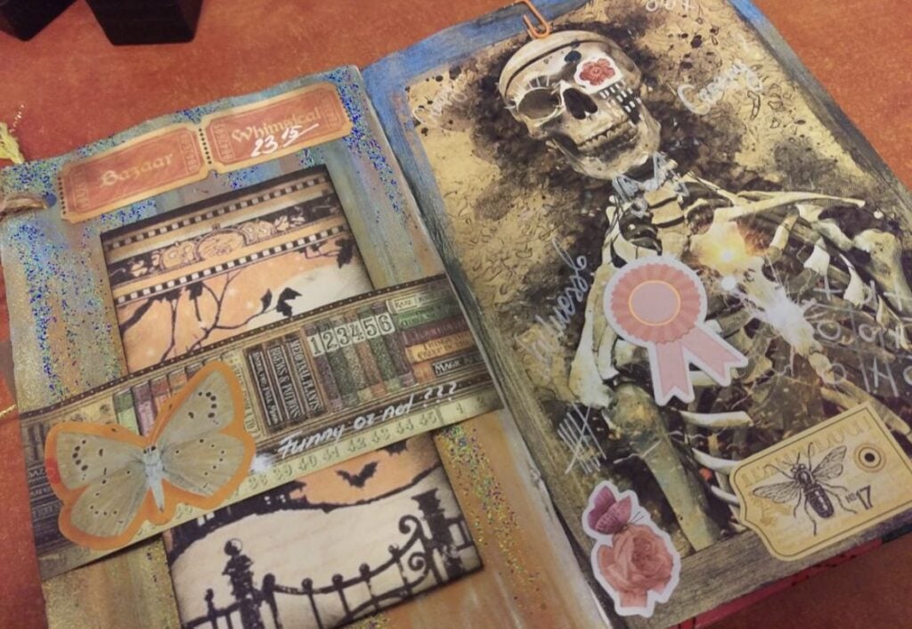 Day of the Dead skeleton junk journal page with pink rosette. Credit: nexus_project_priv