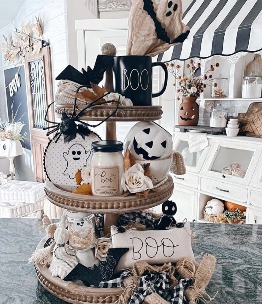 Elegant three tier Halloween  tray with muted colors and black accents perfect for  Halloween vibes. Credit: potoandberrco.