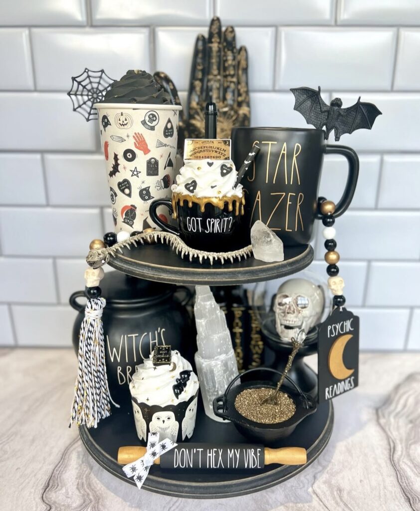 Witch themed tiered tray styled with “Don’t Hex My Vibe” rolling pin. Credit: bowsandsilos, www.slowestuff.com