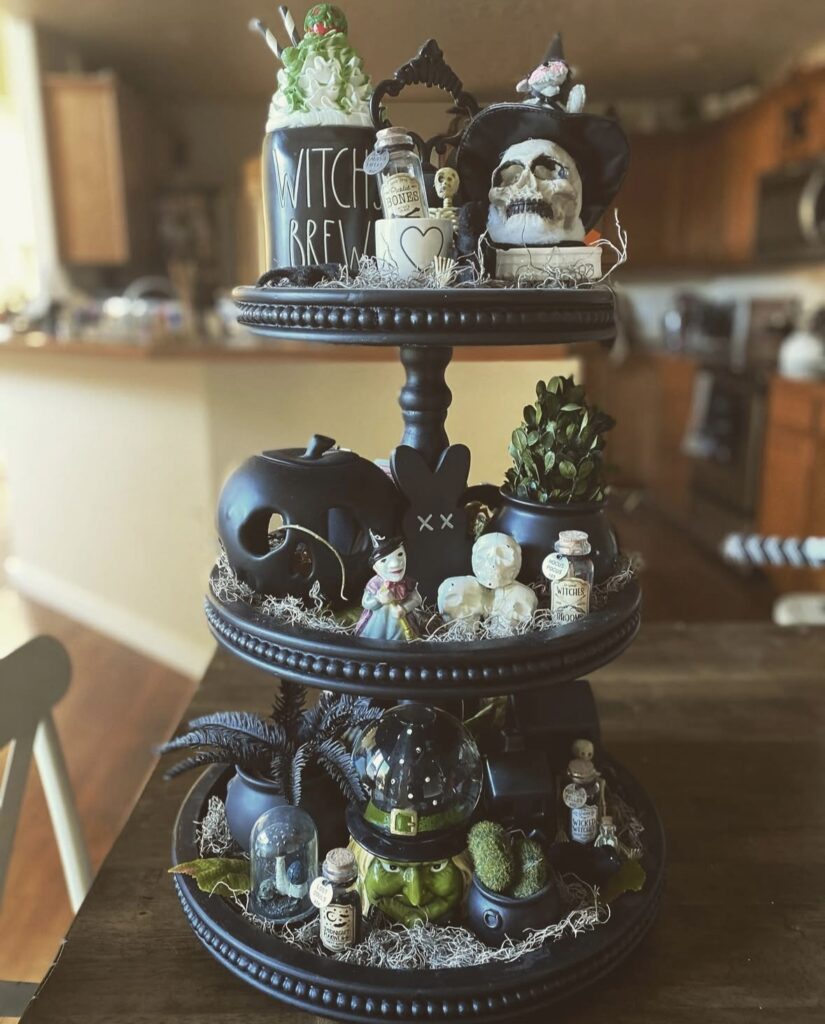 Three-tiered witch tray featuring a witch head, “witch brew” mug, spell book. Credit: hallowqueen87, www.slowestuff.com