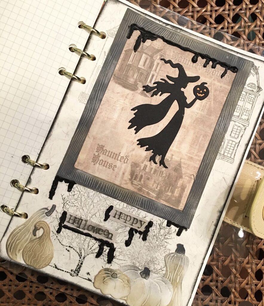 Vintage-inspired witch junk journal layout featuring a silhouette of a flying witch against an antique background, moody inky tones, and magical old-world elements. Credit: @places_faces_