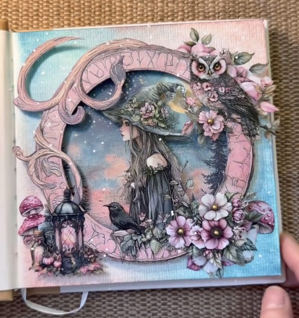 Whimsical witch junk journal layout in pastel blue and pink, featuring a floral witch illustration, soft dreamy accents, and magical cottagecore charm. Credit: @mjserene