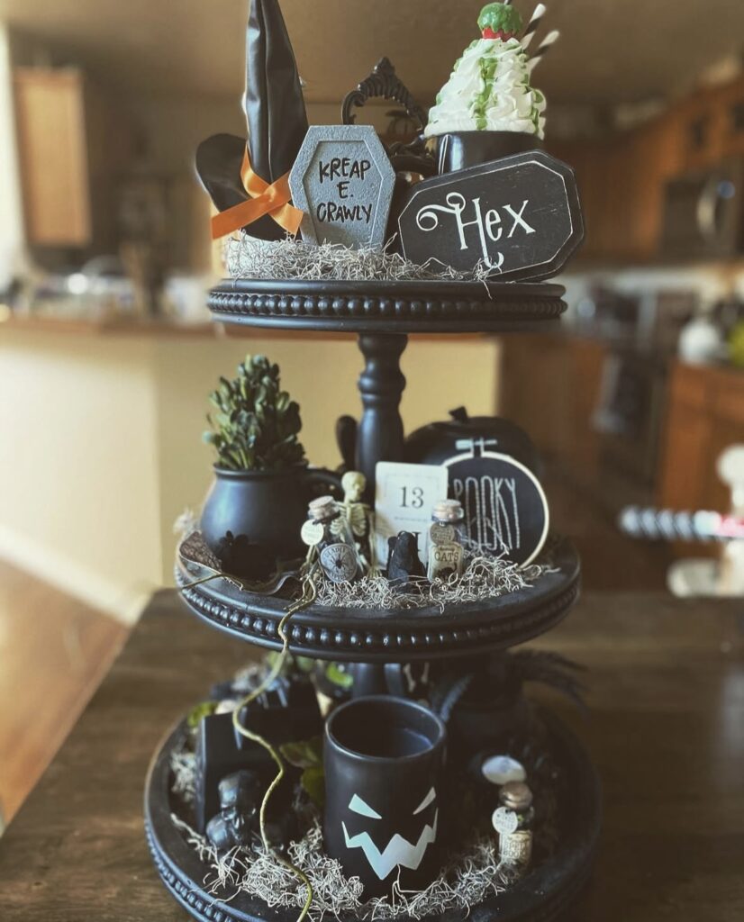 Three-tiered witch tray featuring a witch hat, and hex sign. Credit: hallowqueen87, www.slowestuff.com