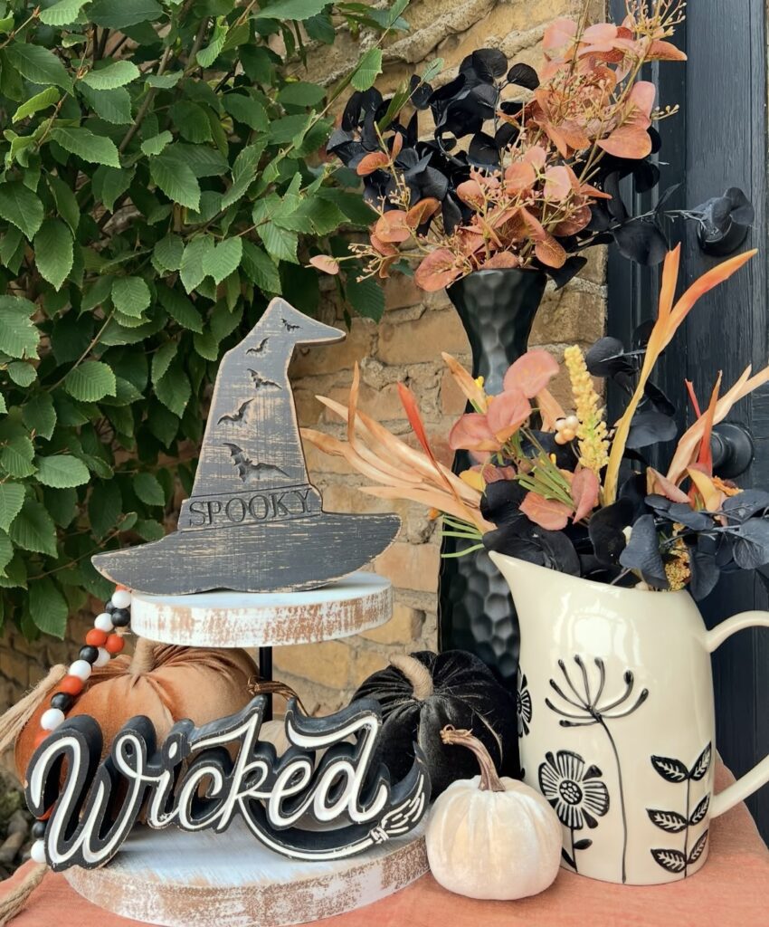 Minimalist witch themed Halloween tray with wooden witch hat, “Wicked” sign, and black tray base. Credit: rodworks, www.slowestuff.com