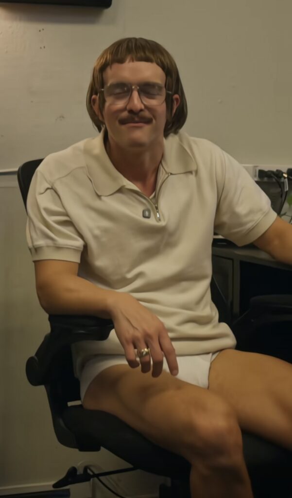 Screenshot of Chit in a short sleeve quarter zip and briefs, showing off his Casual Friday outfit from a viral TikTok skit. Credit: @renshawjay
