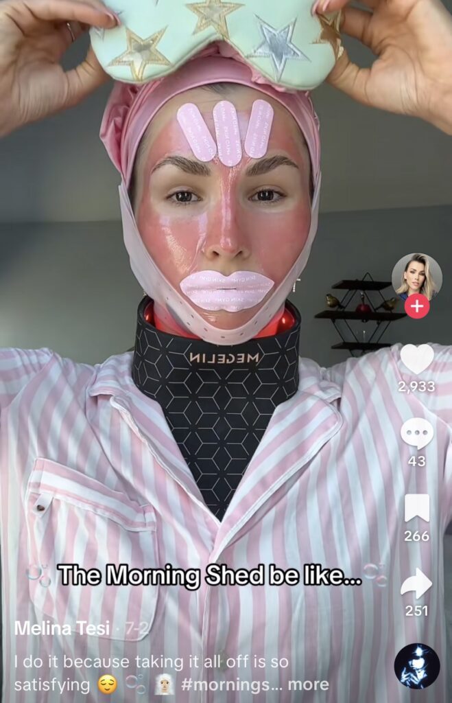 Second image of the “Morning Shed” viral TikTok costume, featuring a woman with multiple beauty accessories, from @melinatesi. Funny DIY Halloween idea for 2025.