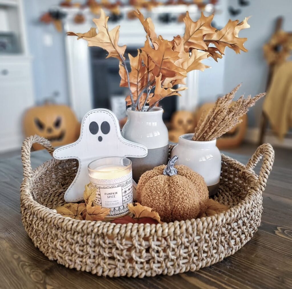 Single-tier tray with a ghost figurine and fall decor in soft, natural oranges, perfect for a simple, neutral Halloween vibe. Credit: craftylittlemarket.