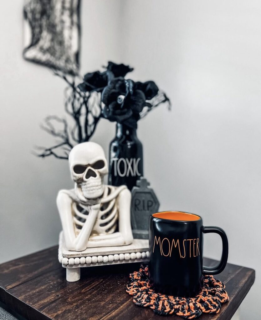 Creative Halloween tray with skeleton torso with momster mug and black roses. Find skeleton tray inspiration at www.slowestuff.com.