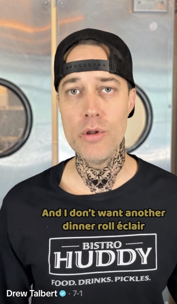 Screenshot of Bistro Huddy from @drew_talbert’s TikTok, showing his signature look with a t-shirt, tattoos, and lip ring. Viral group or solo Halloween costume inspiration for 2025.