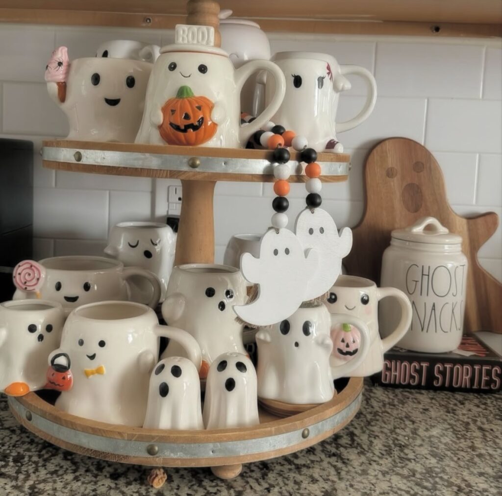 Wooden tiered tray with a collection of ghost mugs in various styles—perfect for a ghostly mug collector! Credit: felicia_loves.