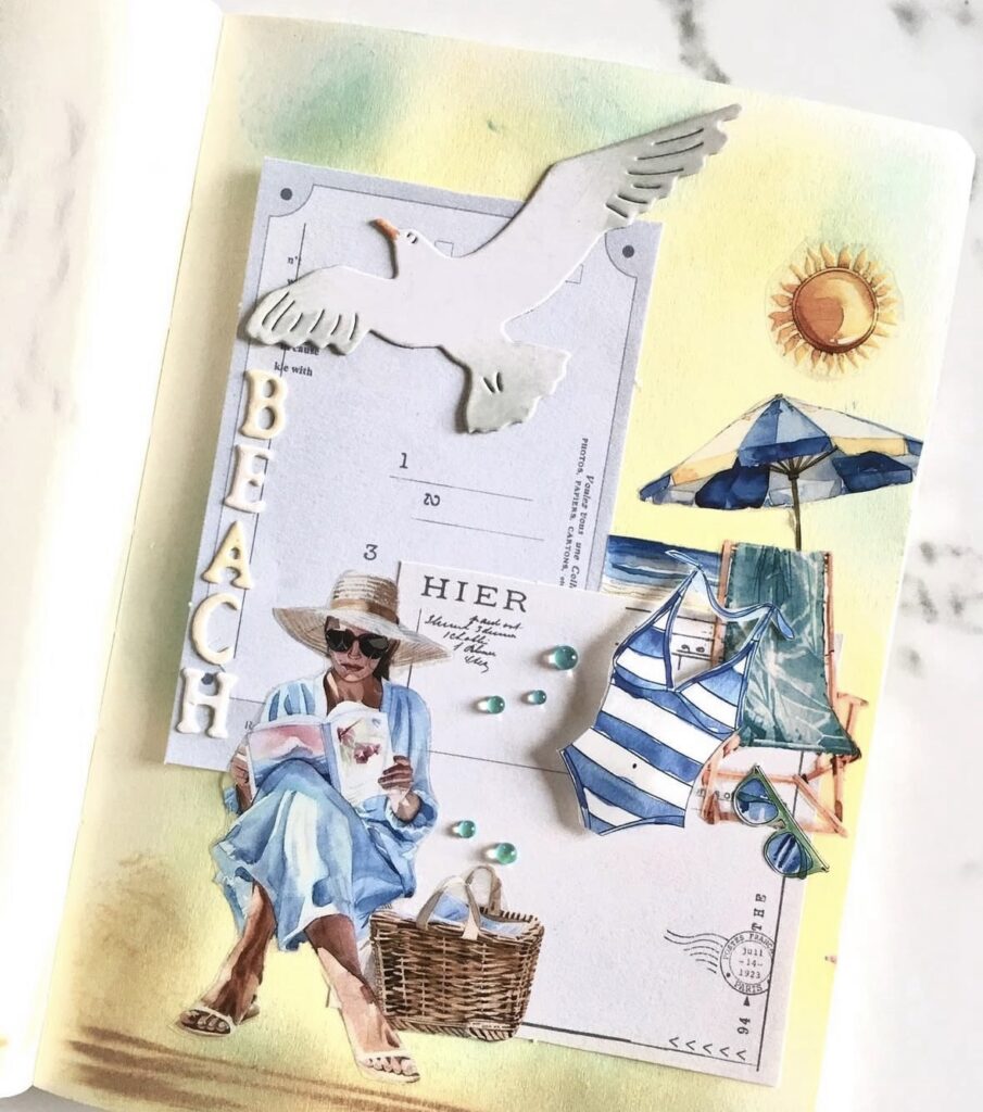 Beach themed journal collage with a seagull, postcard layers, a woman reading, umbrella, swimsuit, and raised letters spelling “BEACH.”