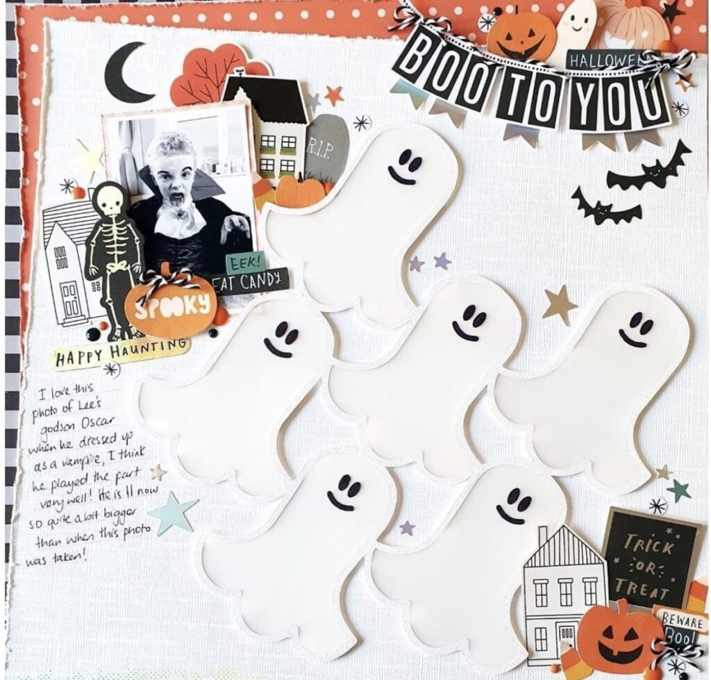 Halloween scrapbook page with white ghosts on a white background with boo to you written in the corner