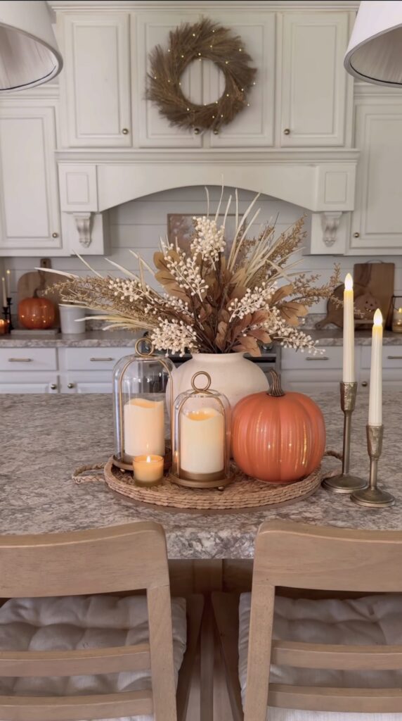 Round tray with neutral pumpkins and vase for autumn decor