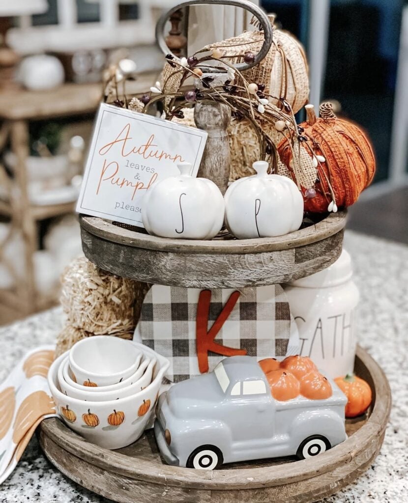 Round two tiered tray with farmhouse decor decorated for fall