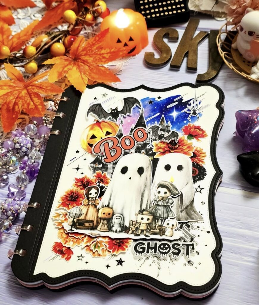 Flatlay of junk journal supplies: ghost ephemera, stamps, lace, labels, and cozy fall palette.