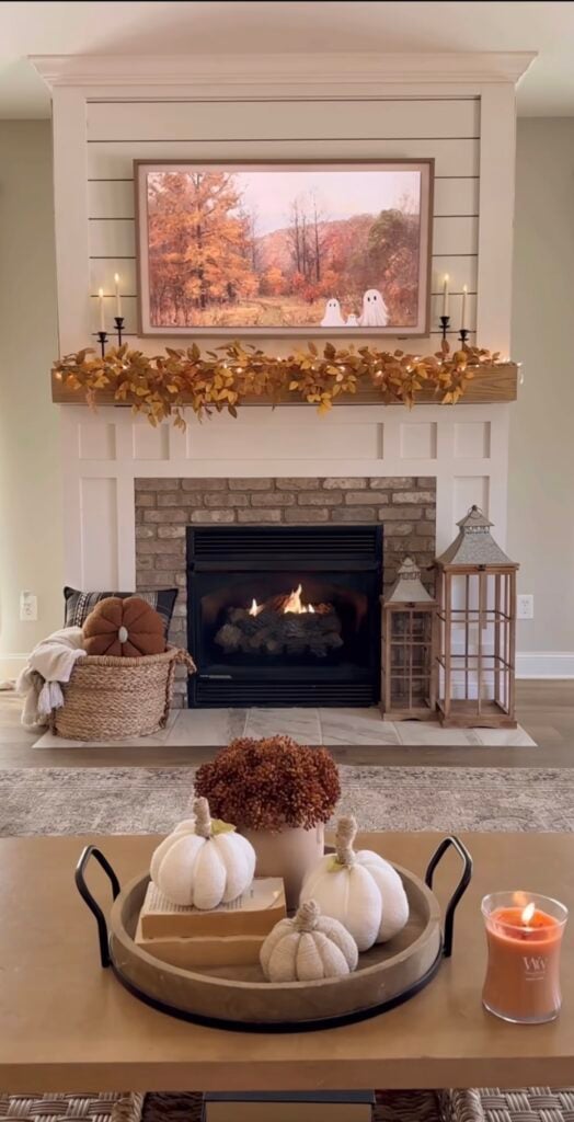 Minimal fall decor living room mantel with framed fall art and a soft neutral palette.