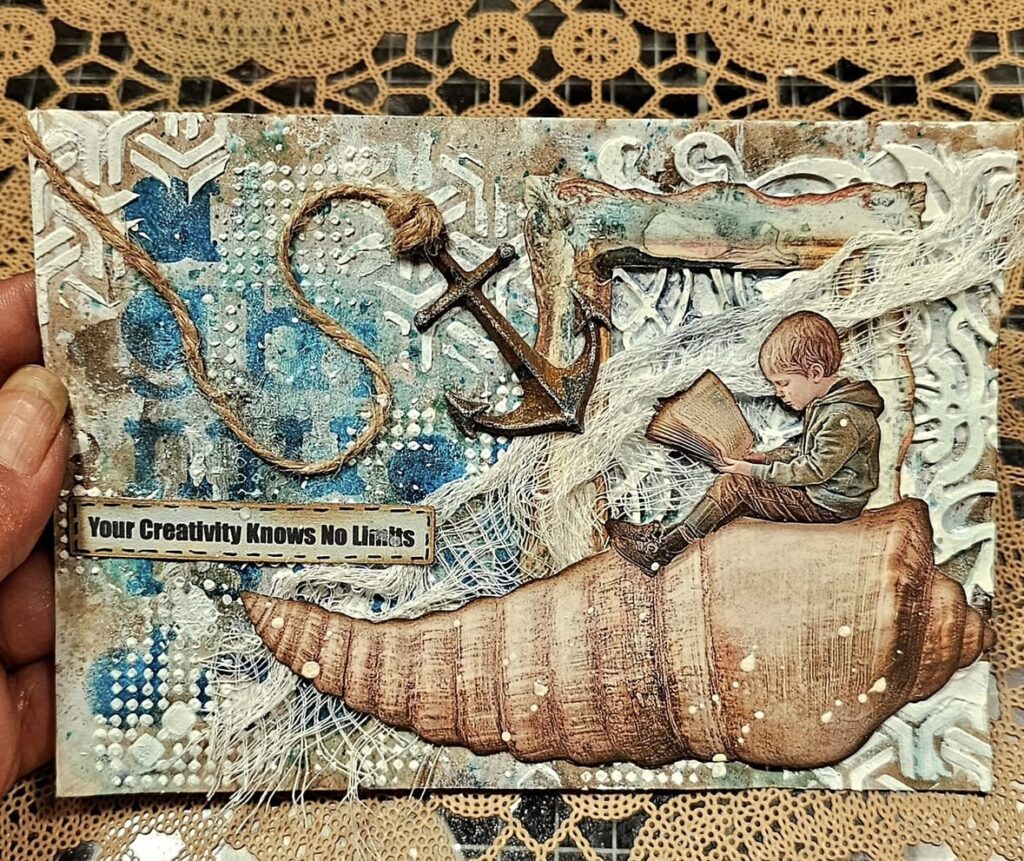 Mixed media ocean collage featuring an anchor, seashells, and a vintage-style illustration of a boy reading with nautical accents.