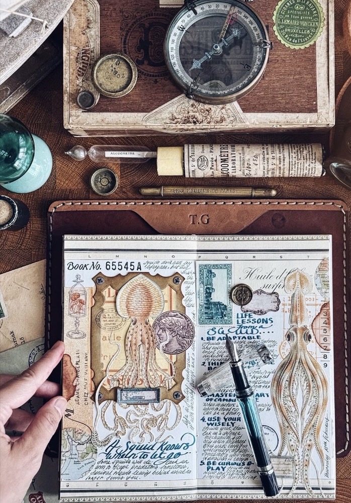 Ocean junk journal page featuring a whale and sea creature collage in blue tones, with layered ephemera and handwritten details