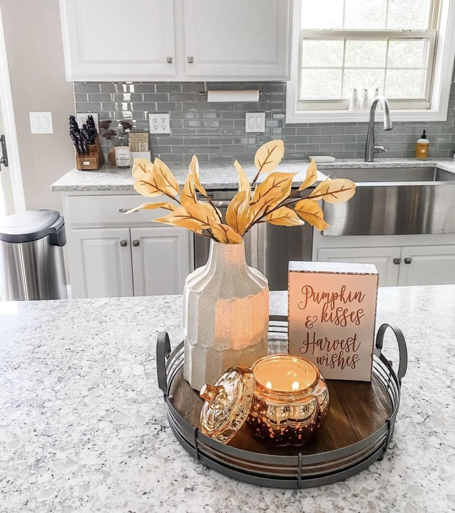 round single tray fall decor in kitchen with sign, candle and vase with yellow foliage