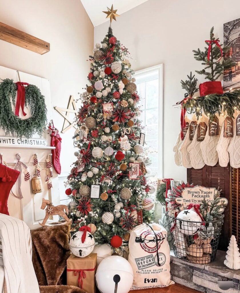 classic red and white Christmas tree with red velvet ribbon, cranberry sprays, snowy pinecones, white lights, woven basket collar