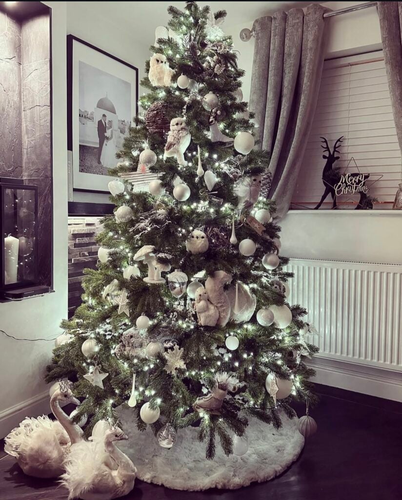 white-woodland-tree—owls—soft-white-ornaments—twinkling-lights—swan-figures—fluffy-skirt