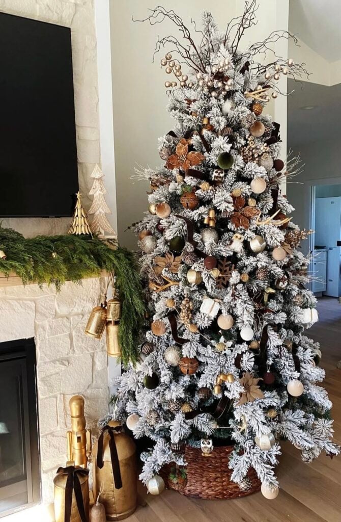 flocked-woodland-tree—brown-and-gold-ornaments—pinecones—velvet-ribbon—wicker-basket-collar