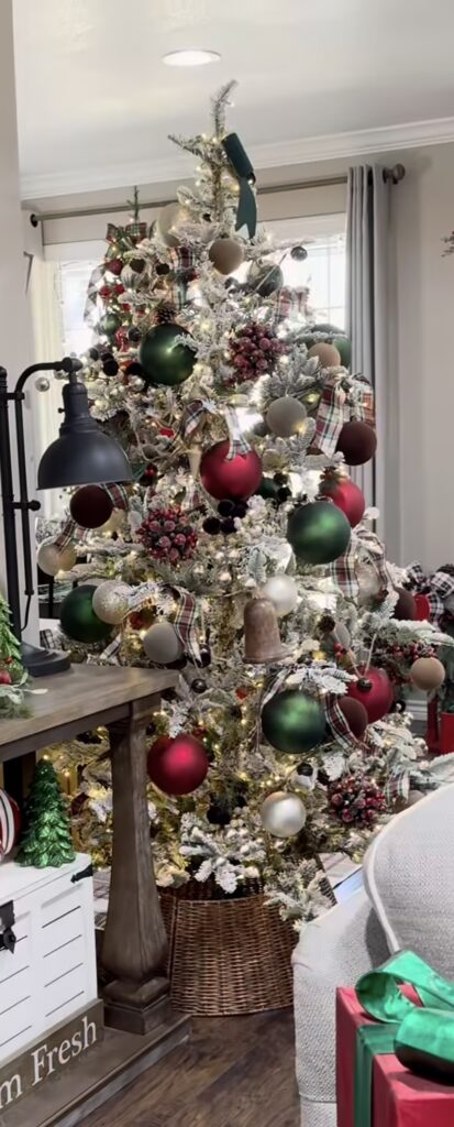 frosted tree with plaid and velvet ornaments in green, red, and gold, basket base