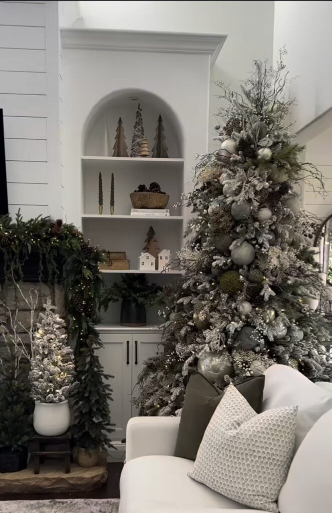 Neutral glam-meets-woodland Christmas tree with pinecones, mossy ornaments, and organic textures.