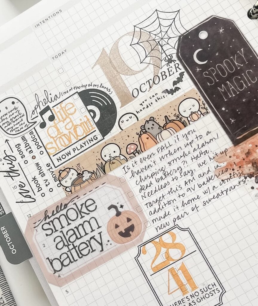 Hobonichi weekly spread with ghost and pumpkin stickers in orange and purple