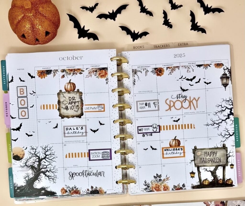 Happy Planner October monthly calendar decorated with bats and pumpkins