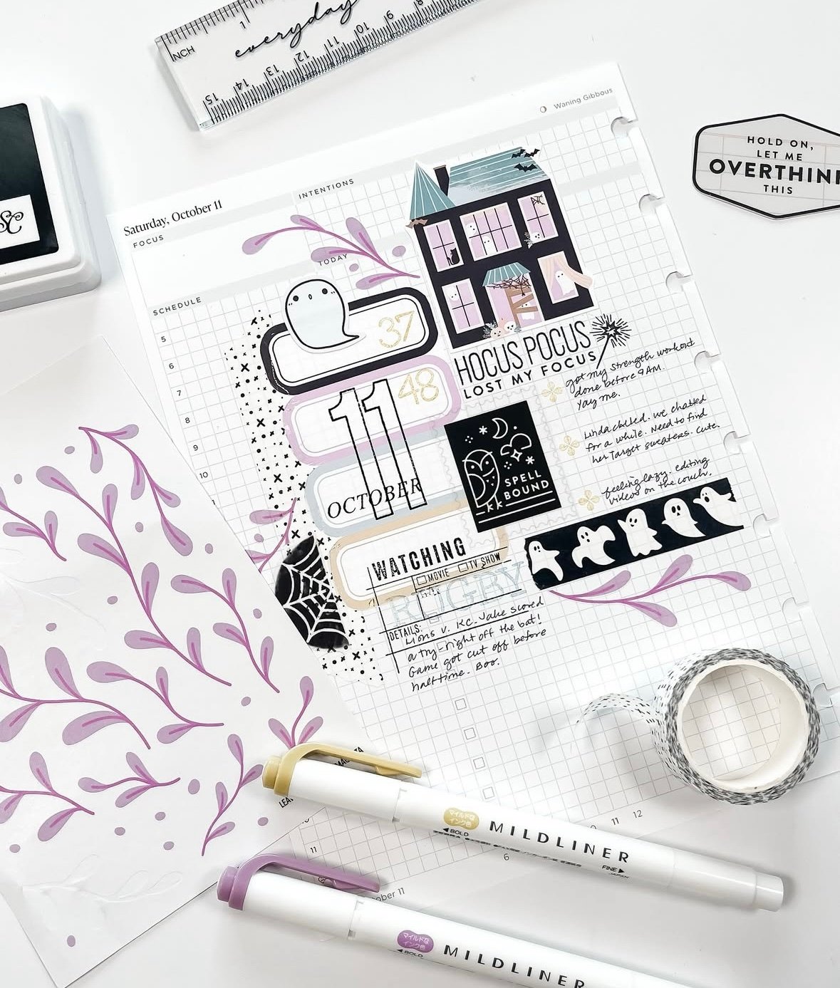Hocus Pocus themed Halloween weekly planner spread with purple ghosts and stickers