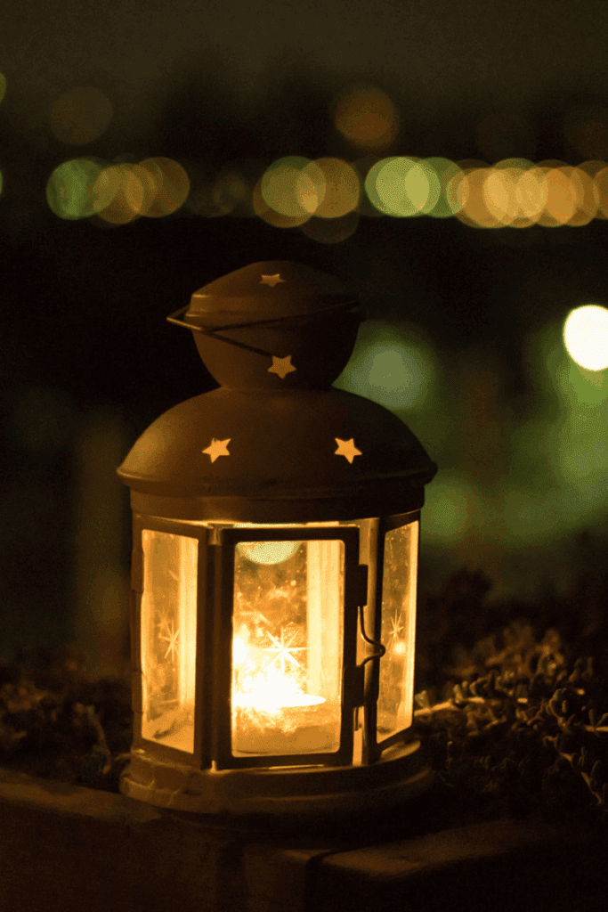 image of a lantern lit at dusk as part of a lantern walk as part of winter solstice celebration