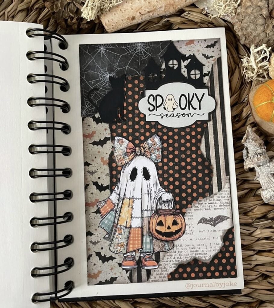 Calico-style stitched ghost embellishments with buttons and fabric scraps on gridded background.