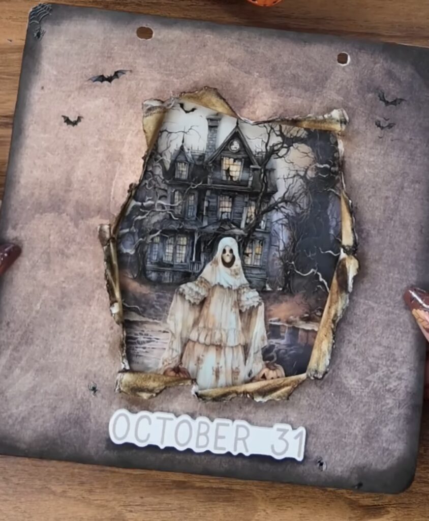 Moody black-and-white ghost composition with stamped cobwebs and distressed edges.