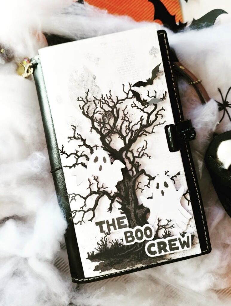 High-contrast ghost page using black florals, die-cut webs, and bold BOO tag.