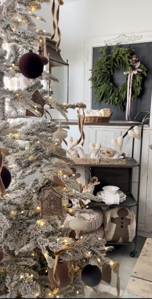 Neutral flocked gingerbread Christmas tree with matte brown baubles, soft white lights, and subtle cookie accents.