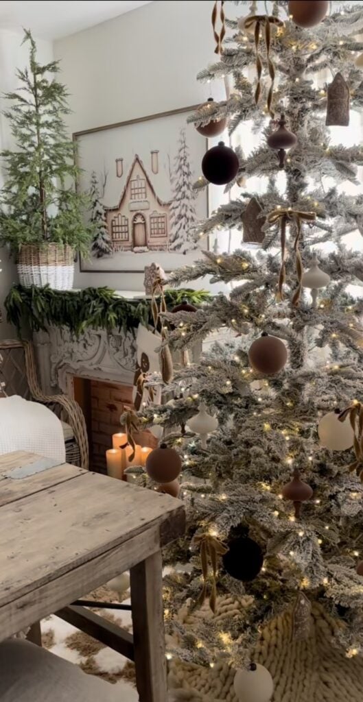 Rustic farmhouse dining room with a neutral gingerbread Christmas tree decorated in warm browns, white ornaments, and subtle cookie accents.